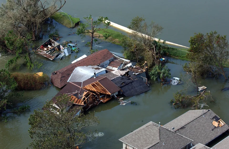 Floodwater beside the 17th Street Canal breach in New Orleans after Katrina; FEMA caption dates the photograph 30 August 2005.